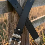 black leather western belt with engraved buckle and decorative tip