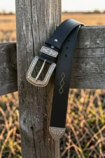 black-leather-western-belt-with-engraved-buckle-and-decorative-tip-closeup