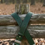 dark green western leather belt with textured finish and engraved buckle
