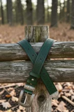dark green western leather belt with textured finish and engraved buckle