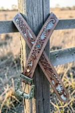 tooled western leather belt with hair-on hide panels stud accents and turquoise detail